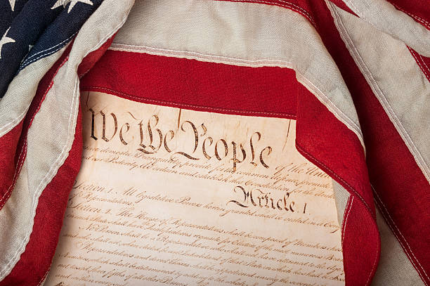 istock United States Constitution with flag 495851643