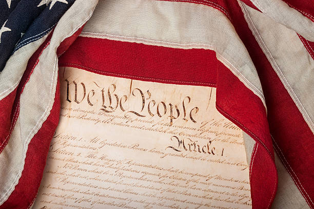 United States Constitution with flag stock photo