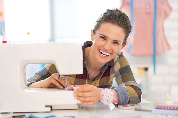 istock portrait of happy seamstress sewing in studio 495852327