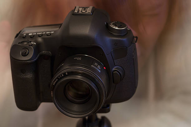istock Modern DSLR with 50 mm lens 495853037