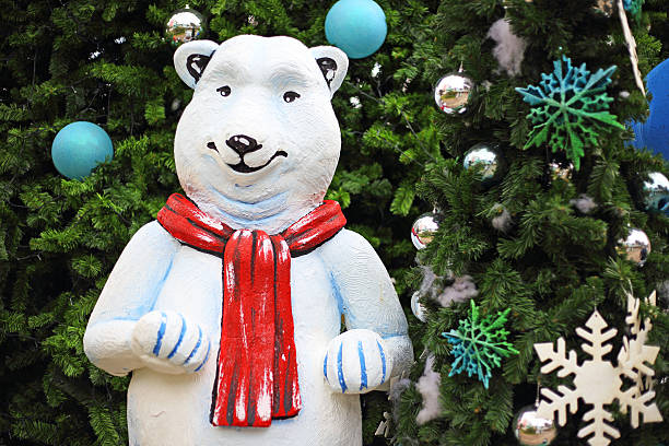 istock white teddy bear with decorations under the Christmas tree 495854063