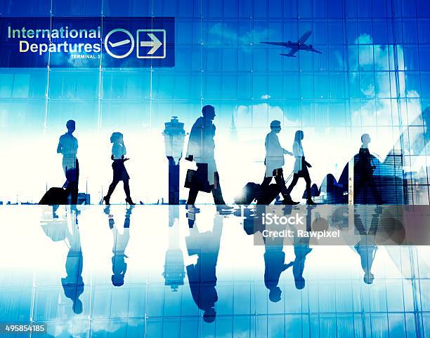 Business People Walking In The Airport Stock Photo - Download Image Now - Airport, Business, Travel