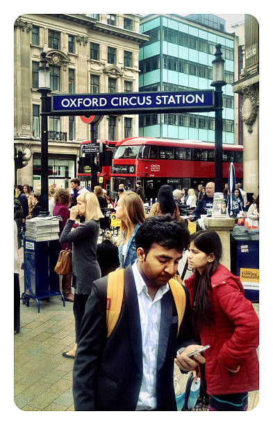 London, UK - May 30, 2014: A busy scene in central London as shoppers and commuters battle their way along London's busiest shopping street to make use of the public transport system.