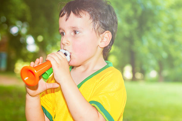 istock Little brazilian supporter with whistle 495856847