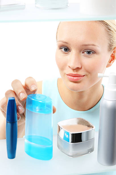 istock Woman buys liquid make-up remover. 495857089