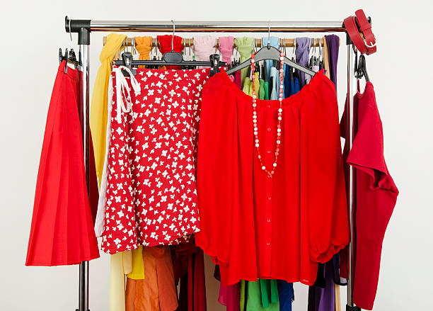 istock Cute summer red outfits displayed on a rack. 495858299