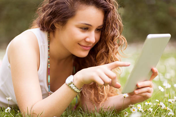 istock Beautiful young woman using a digital tablet 495858917