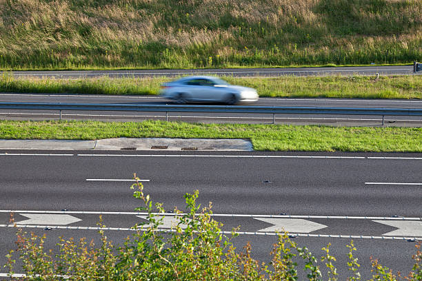 istock car on motorway with motion blur 495867373