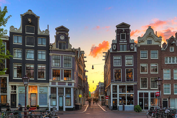 Little Nine Streets sunset Beautiful sunset at one of nine little streets in Amsterdam, the Netherlands canal house photos stock pictures, royalty-free photos & images
