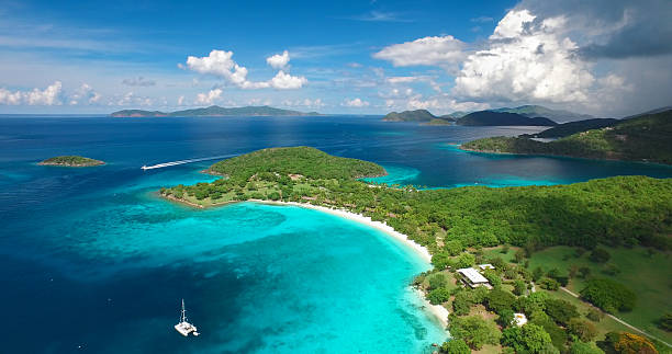 aerial view of Caneel and Hawksnest Bays, St.John, USVI aerial view of Caneel Bay and Hawksnest Bay, St.John, US Virgin Islands with Jost Van Dyke and Tortola, British Virgin Islands in the background St john stock pictures, royalty-free photos & images