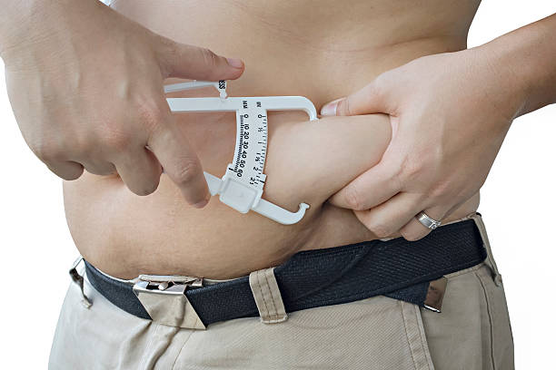体脂肪測定 - men muscular build abdominal muscle large ストックフォトと画像