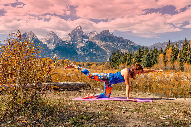 Practicing Yoga in the Tetons stock photo