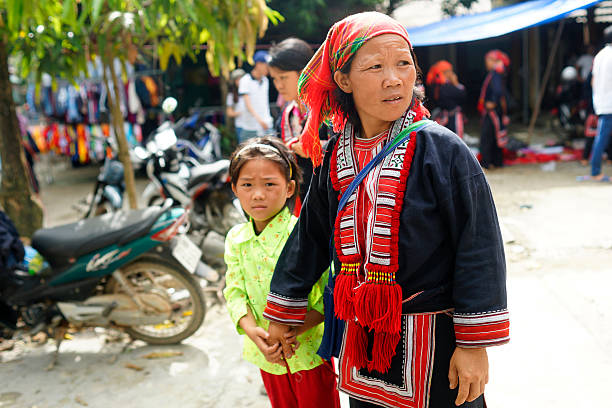 Ethnic groups in Nam market Ha Giang, Vietnam - September 20, 2015: Unidentified people of diferent ethnic groups in Lung Phin market. Lung Phin market is one of the most typical hill tribe markets in Vietnam. bac ha market stock pictures, royalty-free photos & images