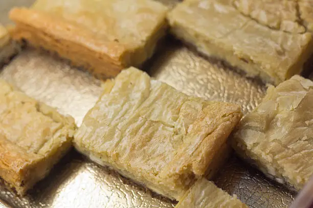 Blondie brownies close up on platter for dessert background