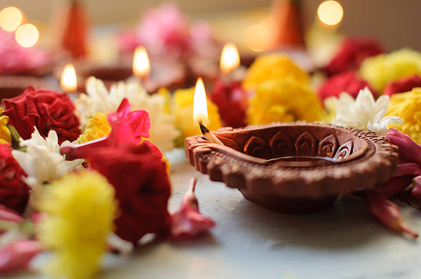 istock Colorful clay diya lamps lit during diwali celebration 495871760