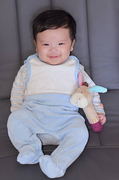 istock Two months asian baby with toy 495872195
