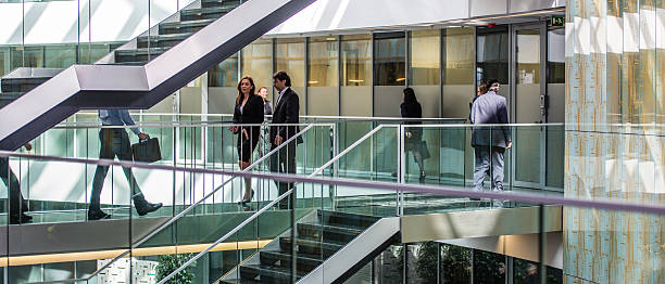 istock Businesspeople walking in office 495872480