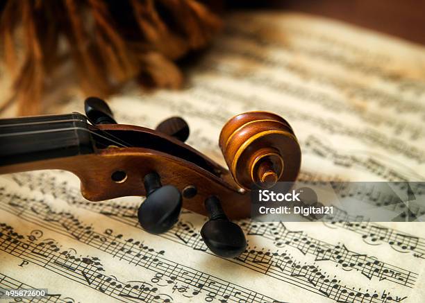 Violin Head On Sheet Music Stock Photo - Download Image Now - Classical Music, Violin, Music