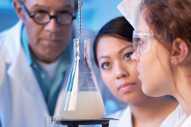 istock Women Science Students Studying Chemistry with Teacher in Laboratory Horizontal 495872697