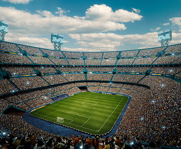 Sunny soccer stadium panorama View from the upper tribunes to the soccer stadium full of spectators.  The sky is blue. hand fan photos stock pictures, royalty-free photos & images