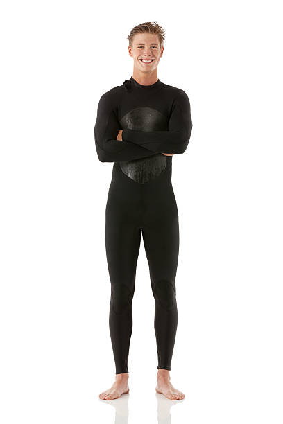 istock Cheerful surfer standing with arms crossed 495872915