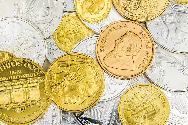 istock mixture of silver and golden coins 495874130