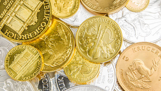 istock mixture of silver and golden coins 495874198