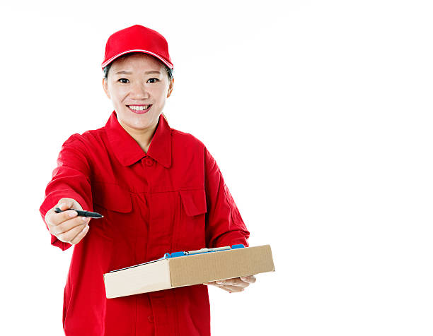 istock Delivery woman holding cardboard box 495875514