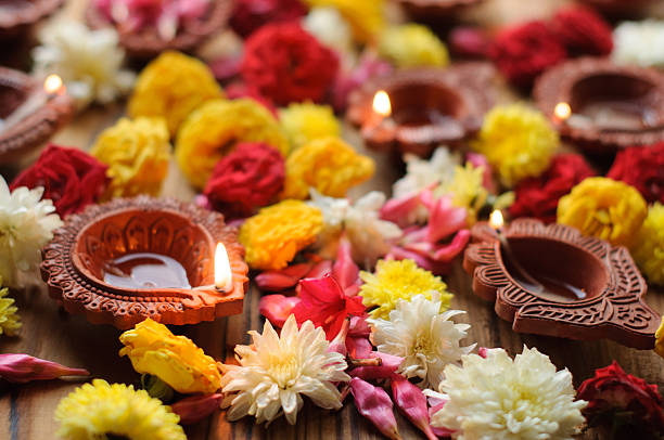 istock Colorful clay diya lamps lit during diwali celebration 495875706