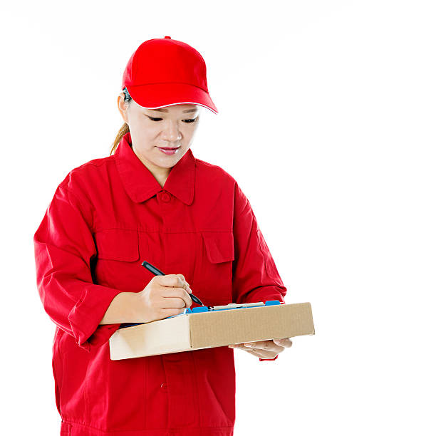 istock Delivery woman holding cardboard box 495876096