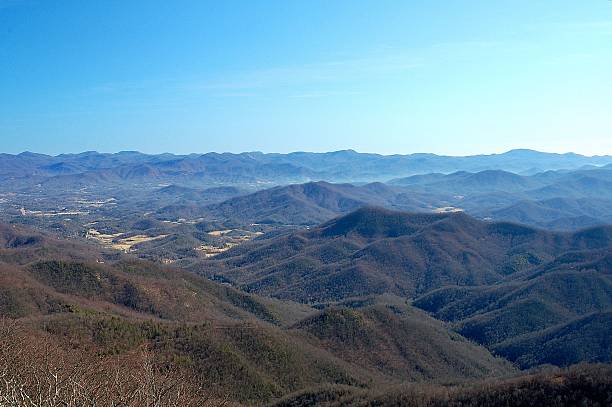 istock Winter view of mountains and valleys covered with trees 495877812