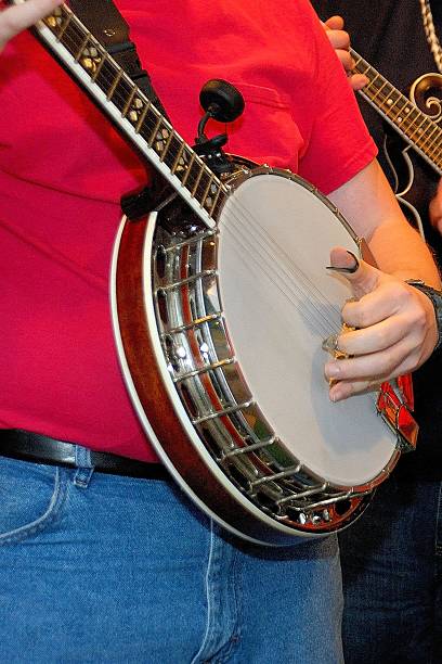 istock Man playing banjo with a band 495877900