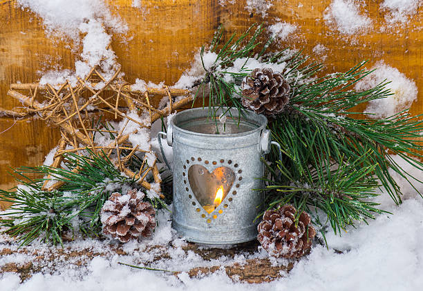 istock Decorative lantern burning in the snow 495879282