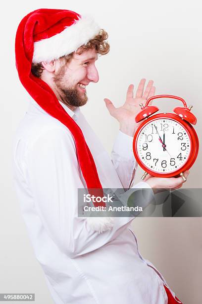 Happy Man With Alarm Clock Christmas Time Stock Photo - Download Image Now - 12 O'Clock, 2015, Adult
