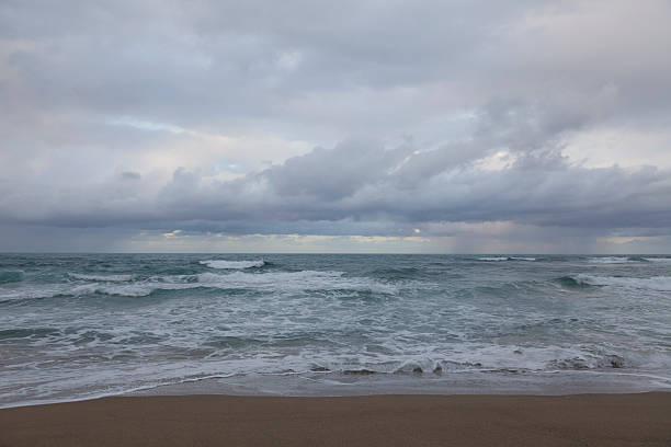 istock Thunderstorm under sea and sand beach. 495881150