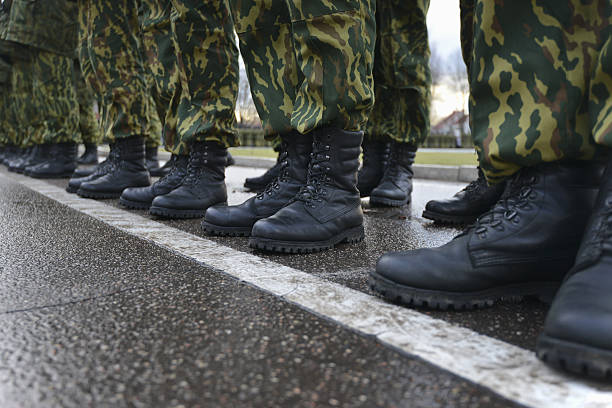 istock Soldiers in camouflage military uniform on rest position 495899470