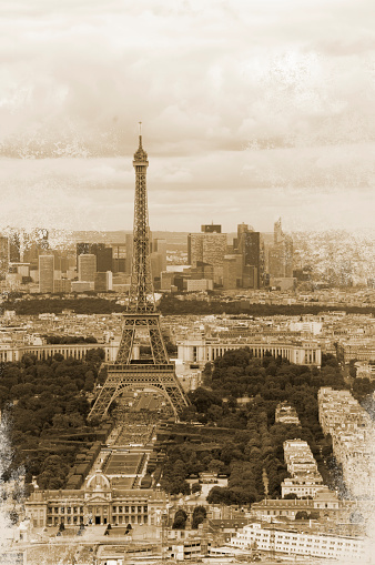 Paris, France - May 1, 2013: Tour Eiffel as seen from the Gardens of Trocadero, with some people and tour buses. In the background the Quartier Du Trocadero