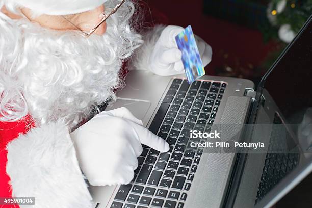 Santa Buying By Plastic Card Christmas Gift In Internet Stock Photo - Download Image Now