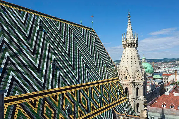 Roof tiles and tower of the Stephansdom, also known as St. Stephen's Cathedral, in Vienna, Austria.