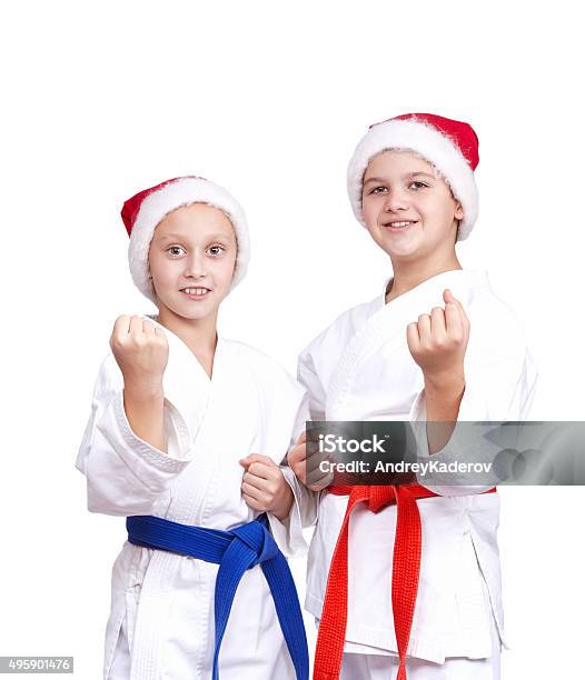 Athletes In Caps Of Santa Claus Are Standing In Rack Stock Photo - Download Image Now