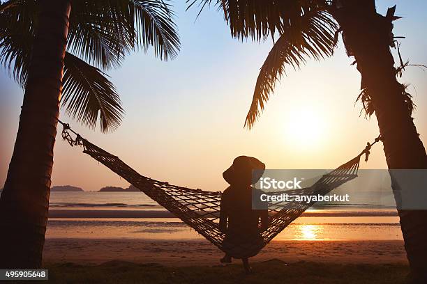 Silhouette Of Woman In Hat Stock Photo - Download Image Now - Beach, Lifestyles, Luxury