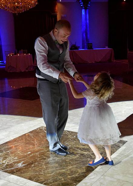 Dancing with daddy Little girl a d her father on the dance floor dancing dad stock pictures, royalty-free photos & images