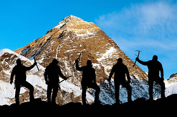 istock Mount Everest and silhouette of climbers 495906538