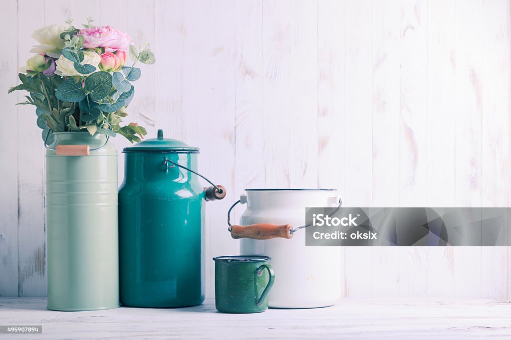 Morning kitchen still life Morning still life with green utensils on shabby chic table and light from the blinds Kitchen Stock Photo