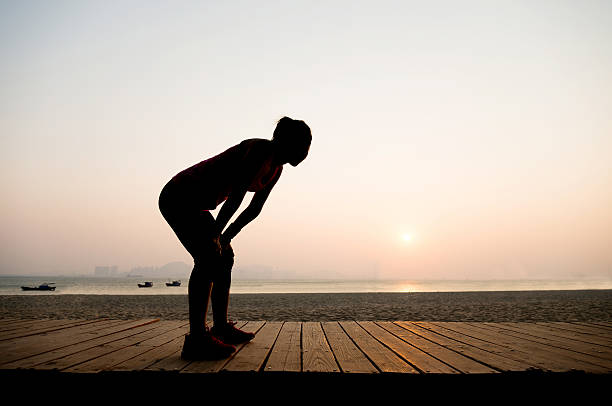 istock Silhouette of a tired runner 495908420