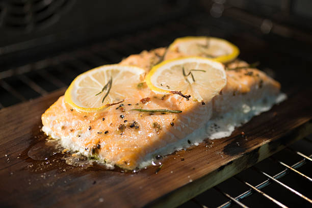 istock The salmon baked on a cedar board 495908684
