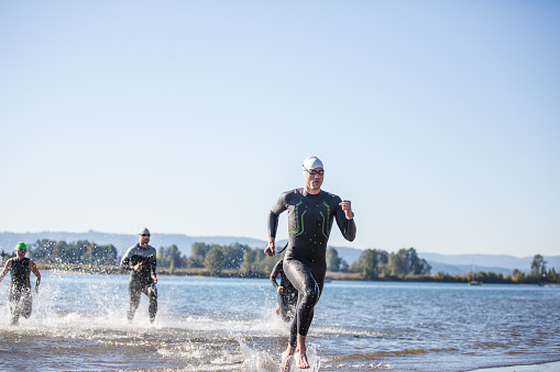 Triathletes training for a triathlon in the Pacific Northwest