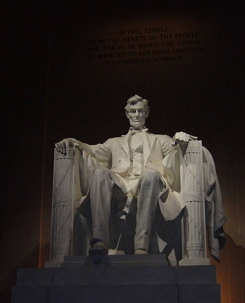 Abraham Lincoln - Lincoln Memorial in Washington DC Nightlight color full view of Abraham Lincoln Statue at the Lincoln Memorial in Washington DC washington dc slavery the mall lincoln memorial stock pictures, royalty-free photos & images