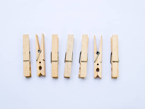 istock Wooden clothespins isolated on white back ground 495912093