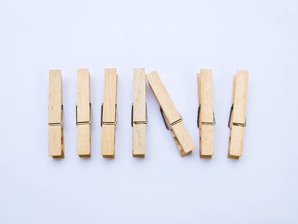 istock Wooden clothespins isolated on white back ground 495912097
